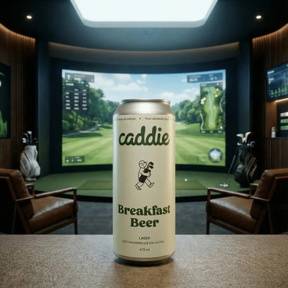 Caddie Breakfast Beer can on a table with a golf simulator in the background